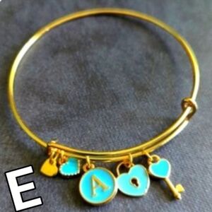 bite & pout "E" Charm Bangle